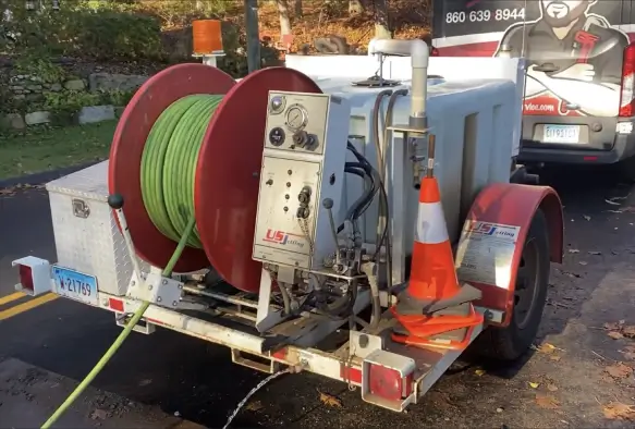 Hydro-jetting equipment trailer clearing stubborn drain blockages