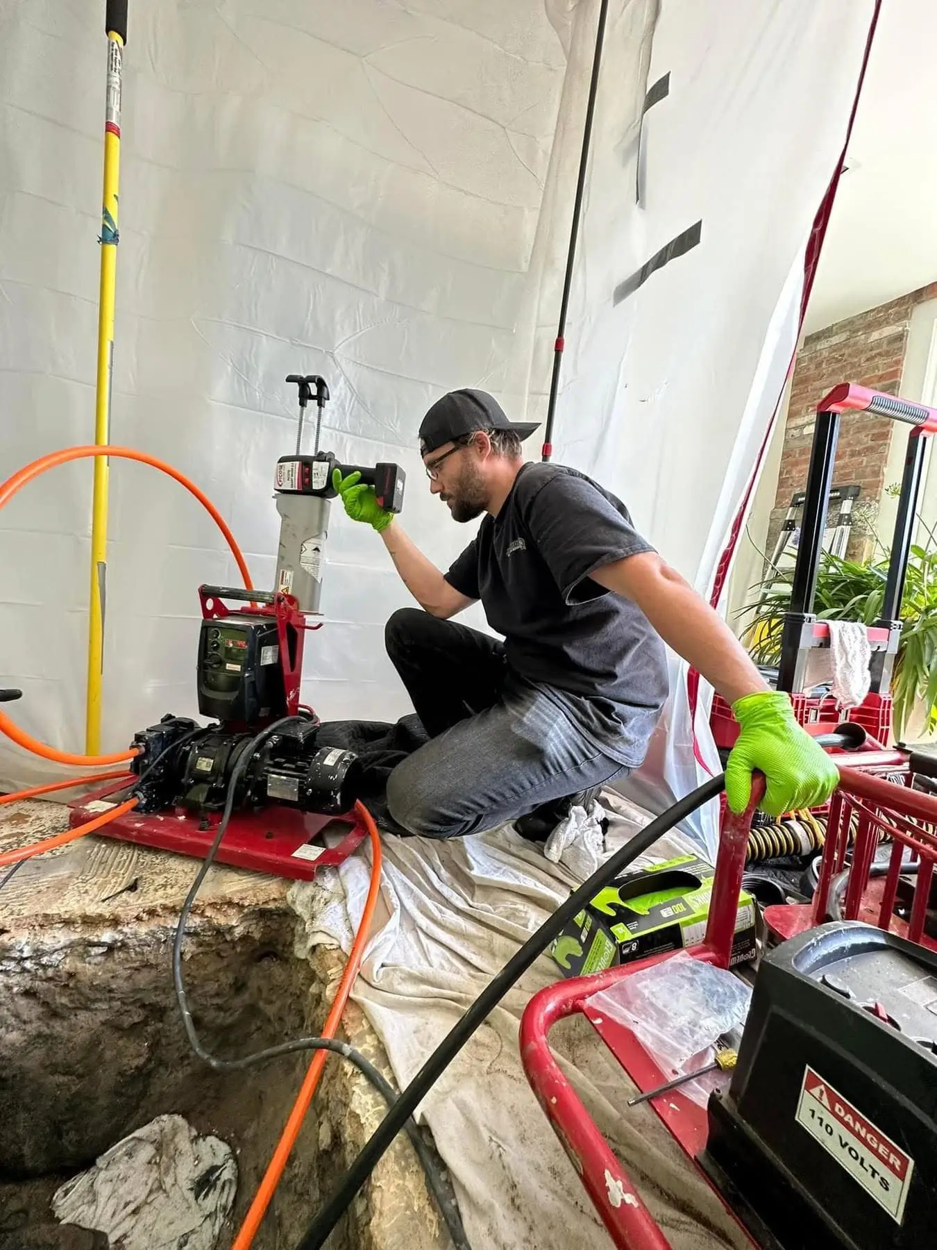 Plumber using sewer camera inspection equipment in Mystic, CT.
