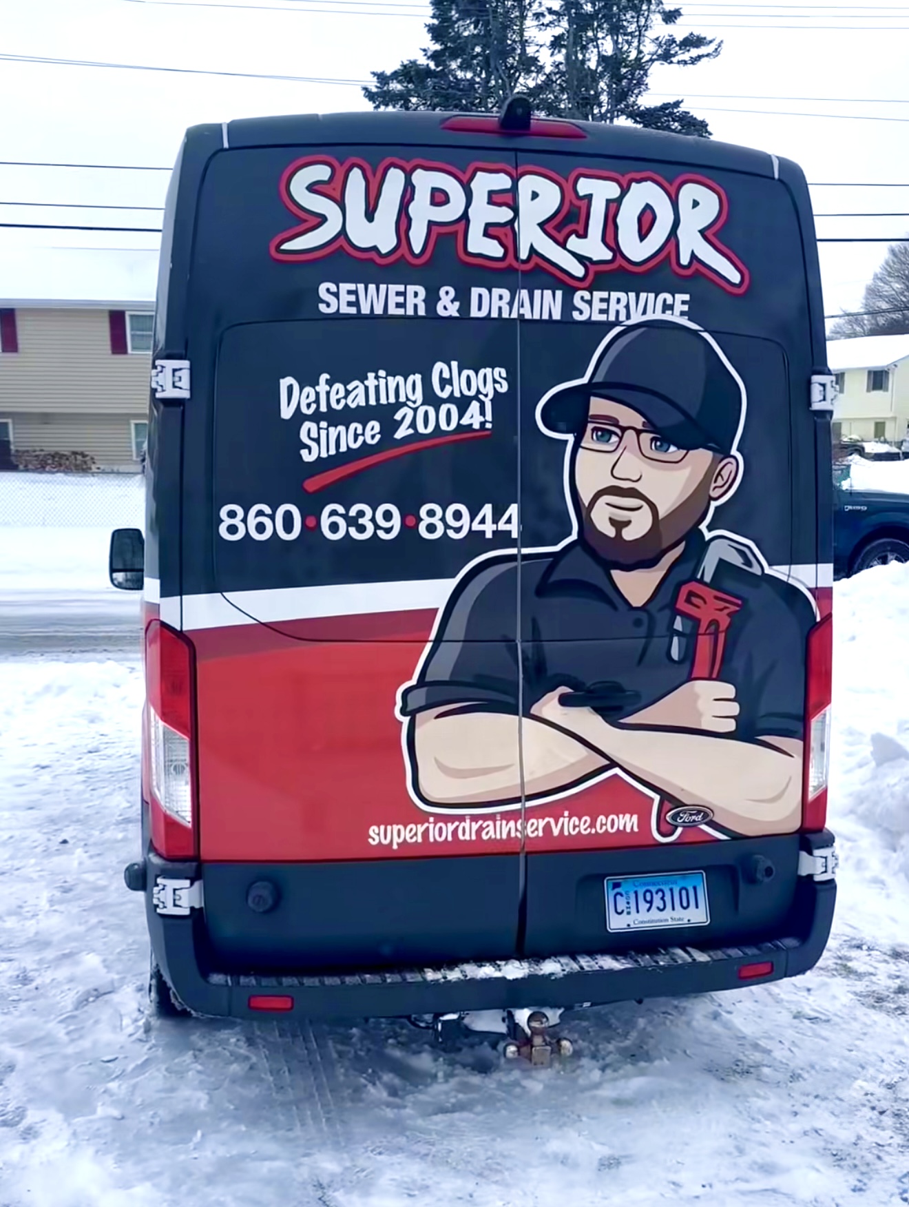 Superior Sewer & Drain Service van in snowy Connecticut, winter drain cleaning services.