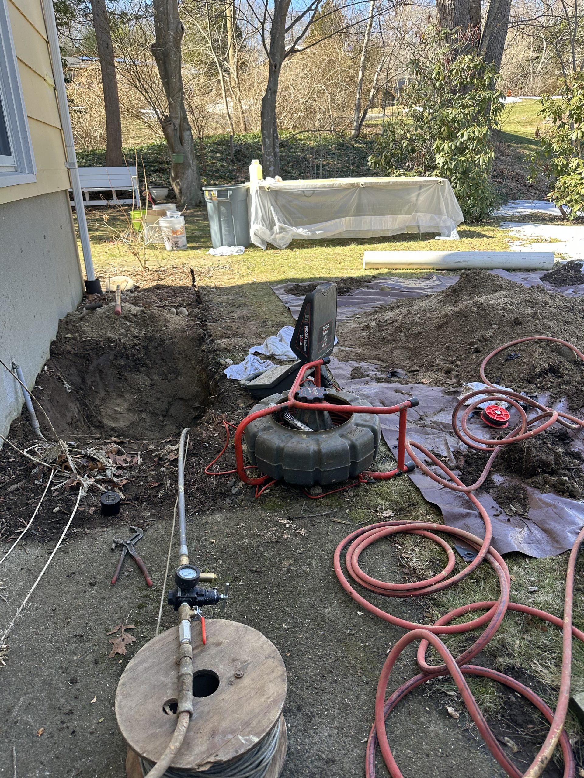 Superior Sewer & Drain employee completing Emergency Plumbing Service on a home in Southeastern CT